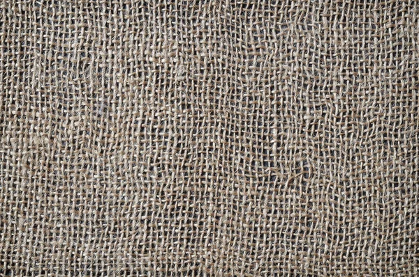 Çuval bezi parçası soyut bir arkaplan olarak yakın plan