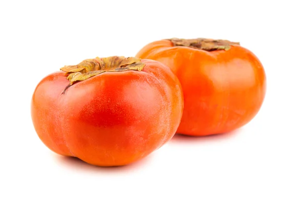 Two ripe persimmons on a white background — Stock Photo, Image