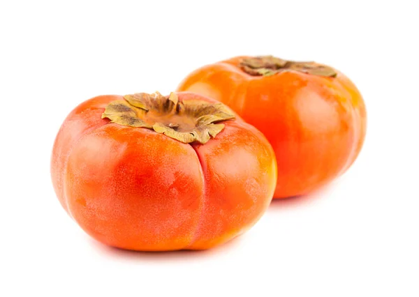Two ripe persimmon fruits on white background — Stock Photo, Image