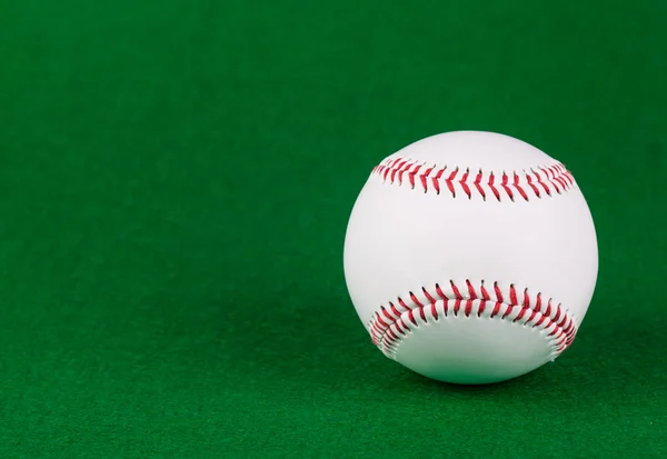 Baseball ball on green background — Stock Photo, Image