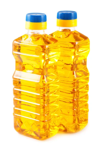 Two plastic bottles of oil — Stock Photo, Image