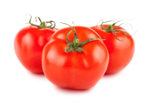 Tres tomates rojos maduros — Foto de Stock