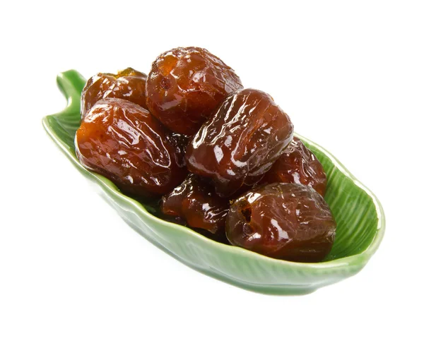 Dried preserved. Sweet syrup monkey apple or Chinese date on bac — Stock Photo, Image