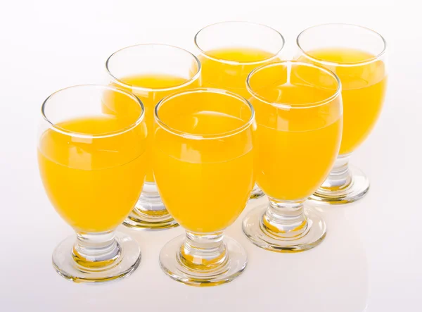 Fruit drink in glasses on white — Stock Photo, Image