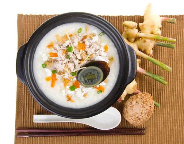 Traditional chinese century egg & pork porridge rice gruel serve — Stock Photo, Image