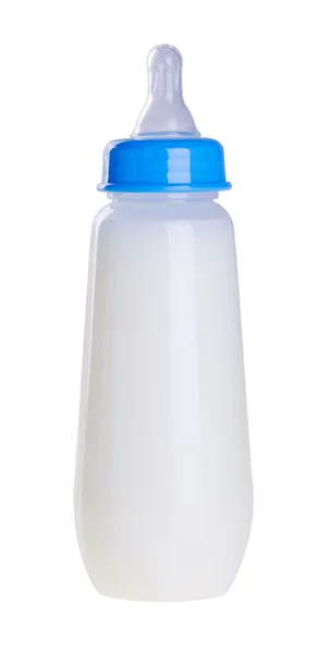 Bottiglia bambino con latte sullo sfondo — Foto Stock