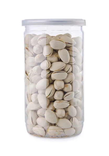 Pistachio nuts in jar on background — Stock Photo, Image