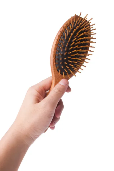 Wooden old comb in hand on blackground — Stock Photo, Image