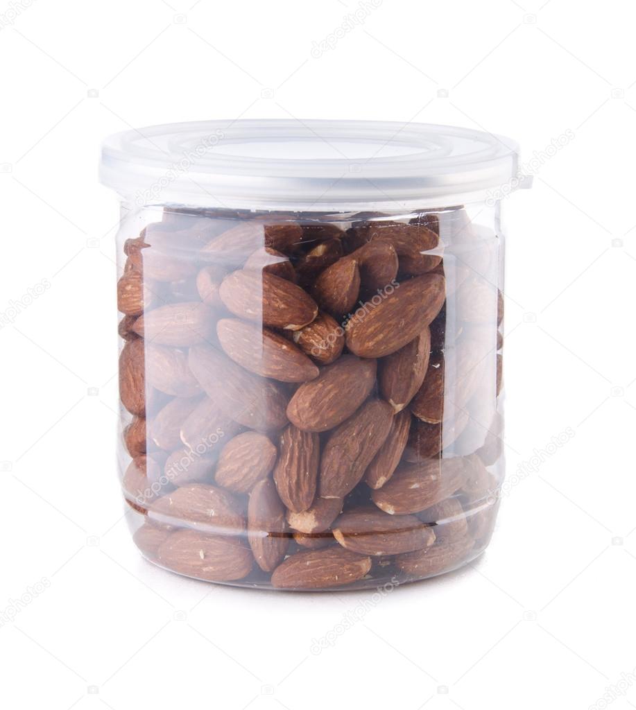 Almond in jar on background