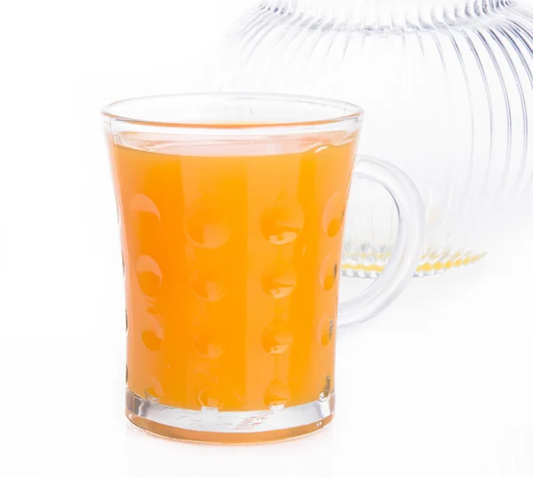 Orangensaft auf einem Hintergrund — Stockfoto