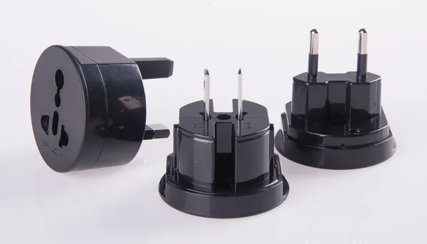 Travel plug adapter on a background — Stock Photo, Image