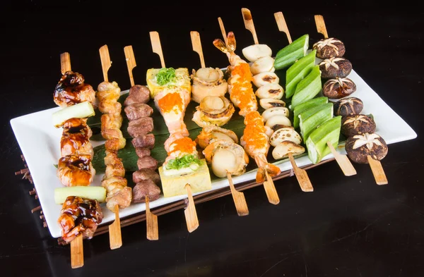 Japanese cuisine. grill stick on the background — Stock Photo, Image