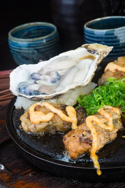 Japanese cuisine. hot plate sea food on the background — Stock Photo, Image