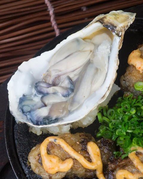 Japanese cuisine. hot plate sea food on the background — Stock Photo, Image