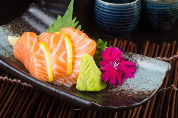 Cocina japonesa. sashimi en el fondo —  Fotos de Stock