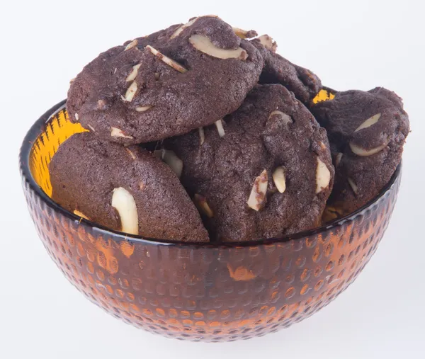 Almendras galletas chips de chocolate en el fondo — Foto de Stock