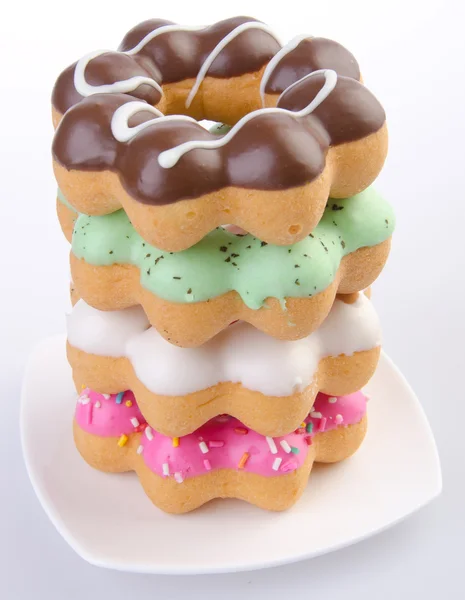 Donut, Donuts de colores en el fondo — Foto de Stock