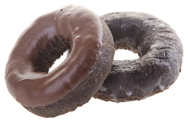 Donuts de chocolate em um contexto — Fotografia de Stock