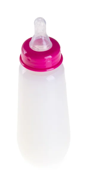 婴儿奶瓶的用牛奶背景上 — 图库照片