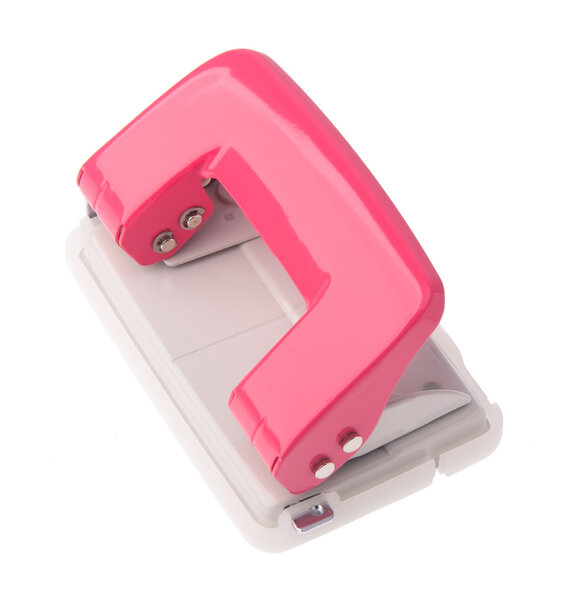 Office paper hole puncher on background