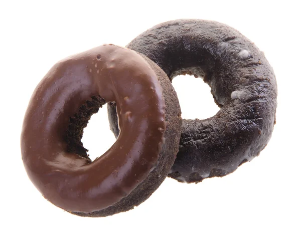 Donuts de chocolate em um contexto — Fotografia de Stock