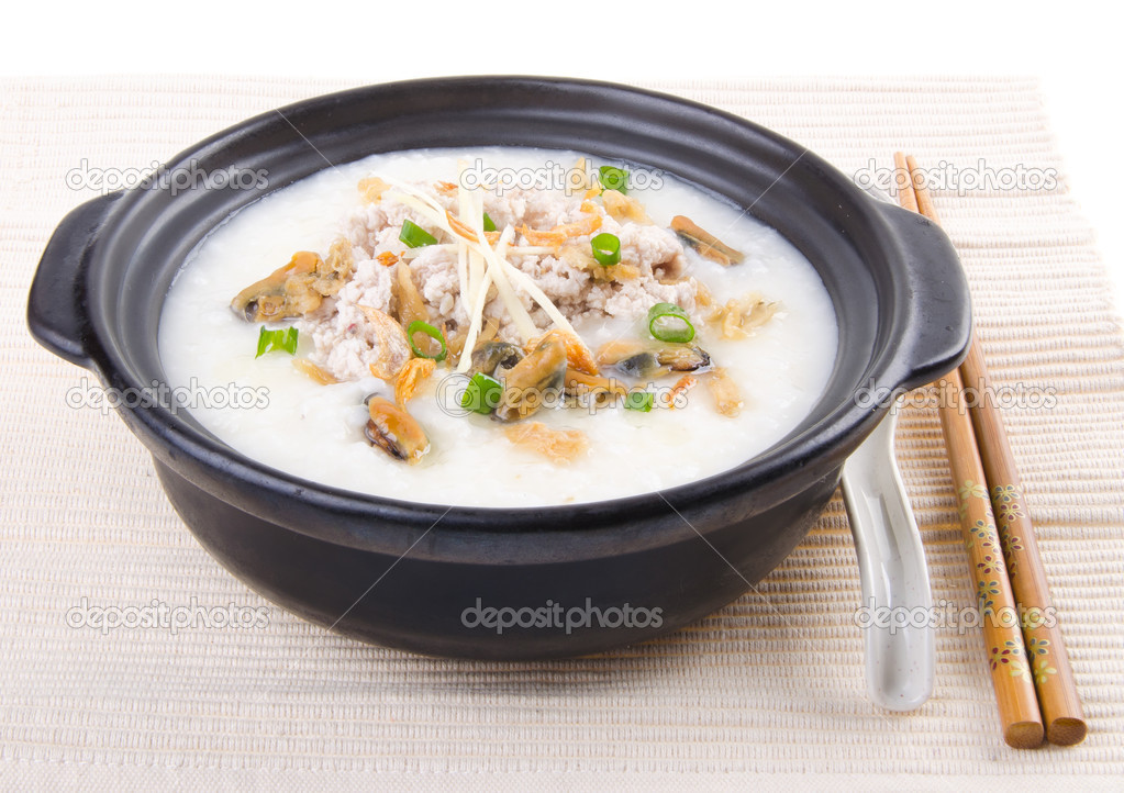 Traditional chinese pork porridge rice gruel served in claypot