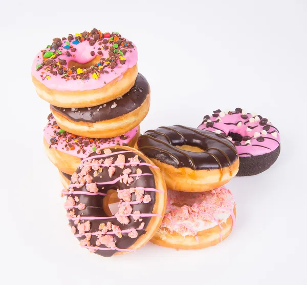 Donuts sortidos rosquinhas em um fundo — Fotografia de Stock