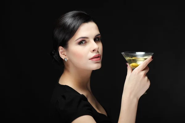 Beautiful young girl with glass of martini — Stock Photo, Image