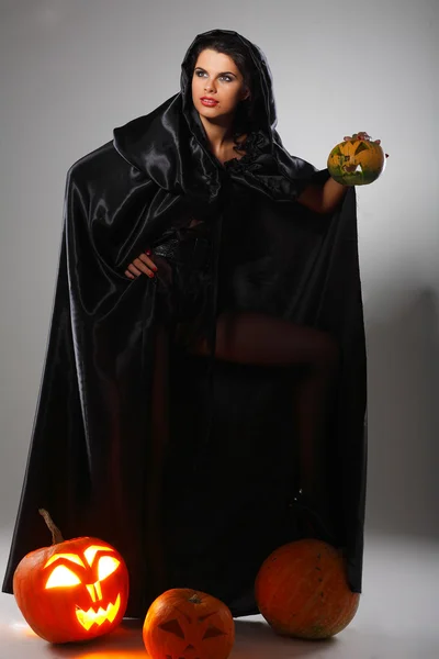 Sexual brunette in the suit of witch in night of Halloween — Stock Photo, Image