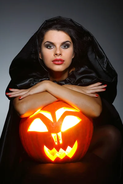 Sexual brunette in the suit of witch in night of Halloween Royalty Free Stock Images