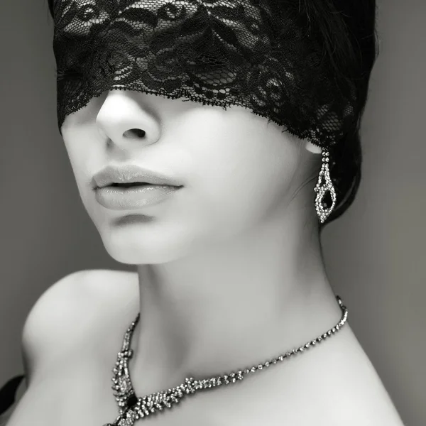 Portrait elegant sexual brunette woman is in a black lace mask — Stock Photo, Image