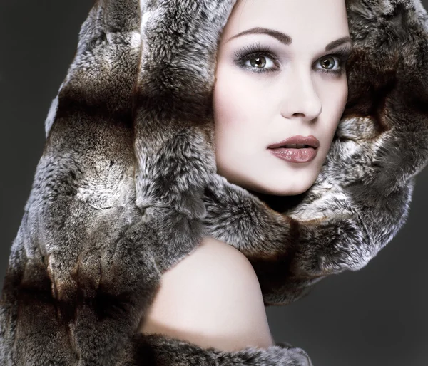 A photo of sexual beautiful girl is in fur clothes — Stock Photo, Image