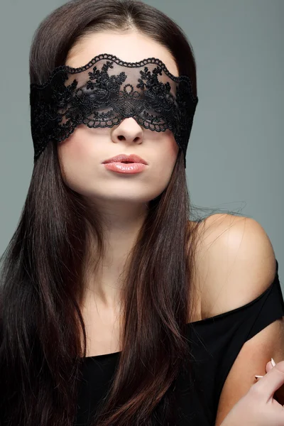 Portrait elegant sexual brunette woman is in a black lace mask — Stock Photo, Image