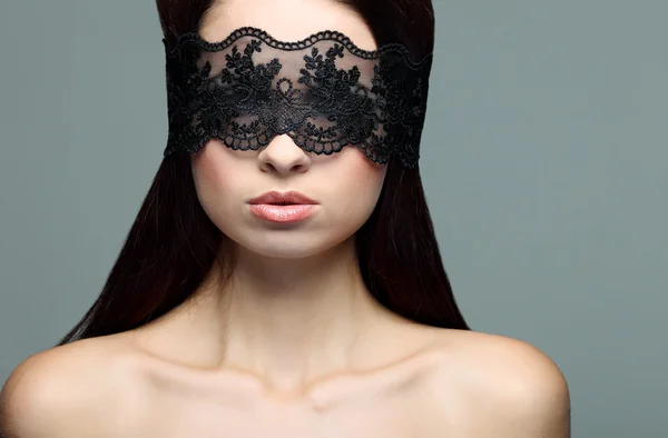 Portrait elegant sexual brunette woman is in a black lace mask — Stock Photo, Image