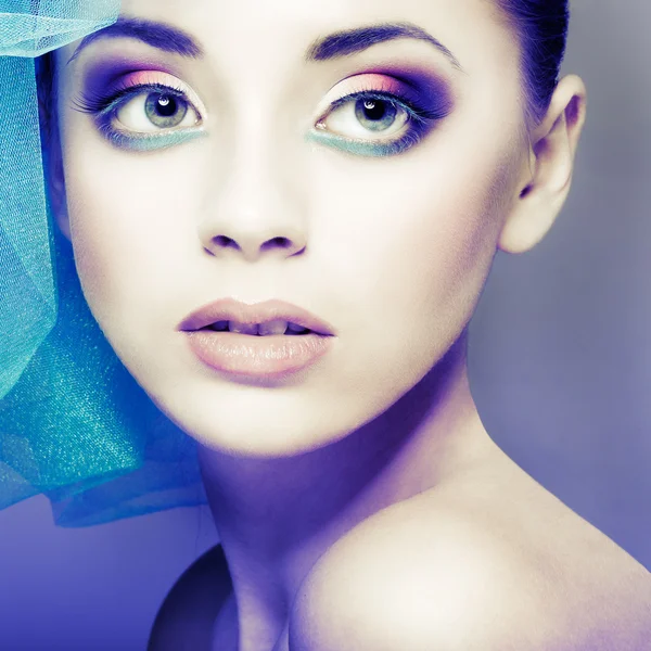 Portrait of beautiful girl with a hat from a blue veil — Stock Photo, Image