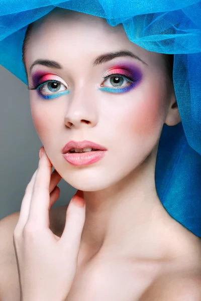 Portrait of beautiful girl with a hat from a blue veil — Stock Photo, Image