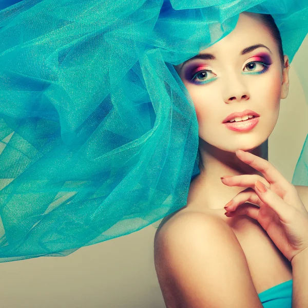 Portrait of beautiful girl with a hat from a blue veil — Stock Photo, Image