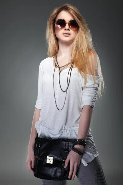 A photo of beautiful girl is in fashion style on grey background, glamour — Stock Photo, Image