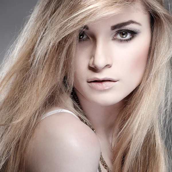 Closeup portrait of sexy whiteheaded young woman with beautiful blue eyes on grey background — Stock Photo, Image