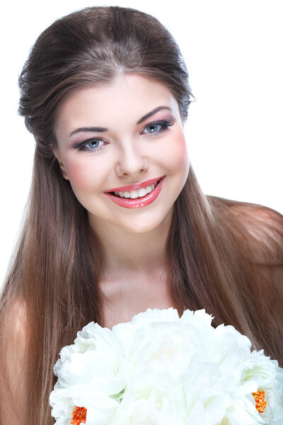 beautiful young girl with the bouquet of white colors in a hand
