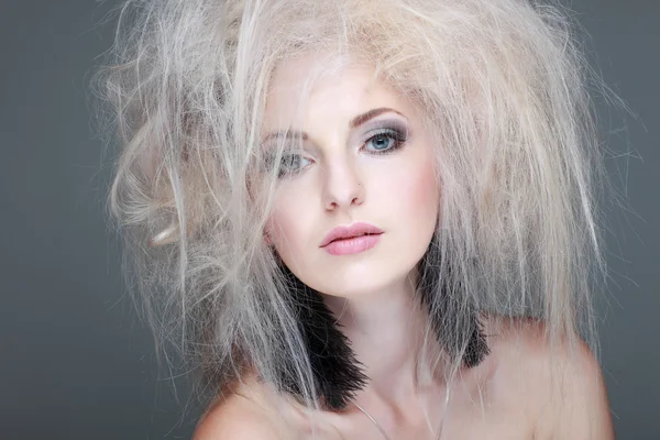 Closeup portrait of sexy whiteheaded young woman with beautiful blue eyes on grey background — Stock Photo, Image