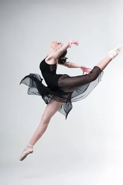 Beautiful ballet-dancer, modern style dancer posing on studio background Royalty Free Stock Images