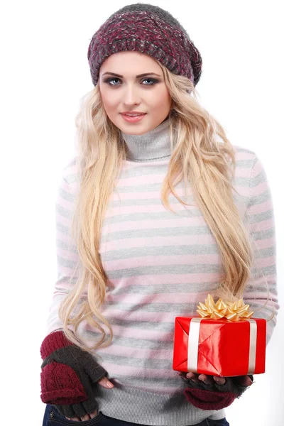 A photo of beautiful girl is in winter clothes with red gift box, isolated — Stock Photo, Image