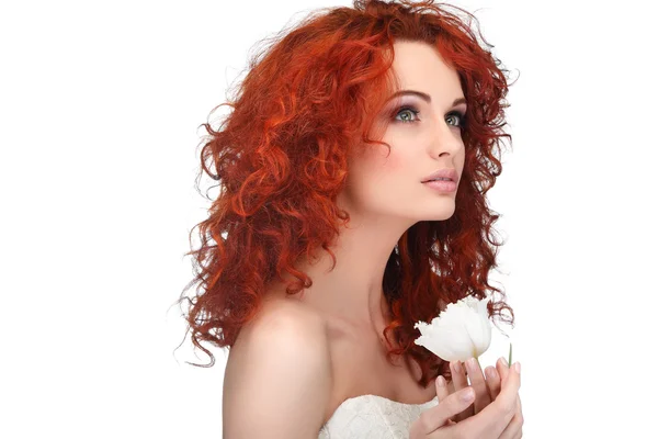 Beautiful young redheaded girl with white tulips, isolated on a white background — Stock Photo, Image