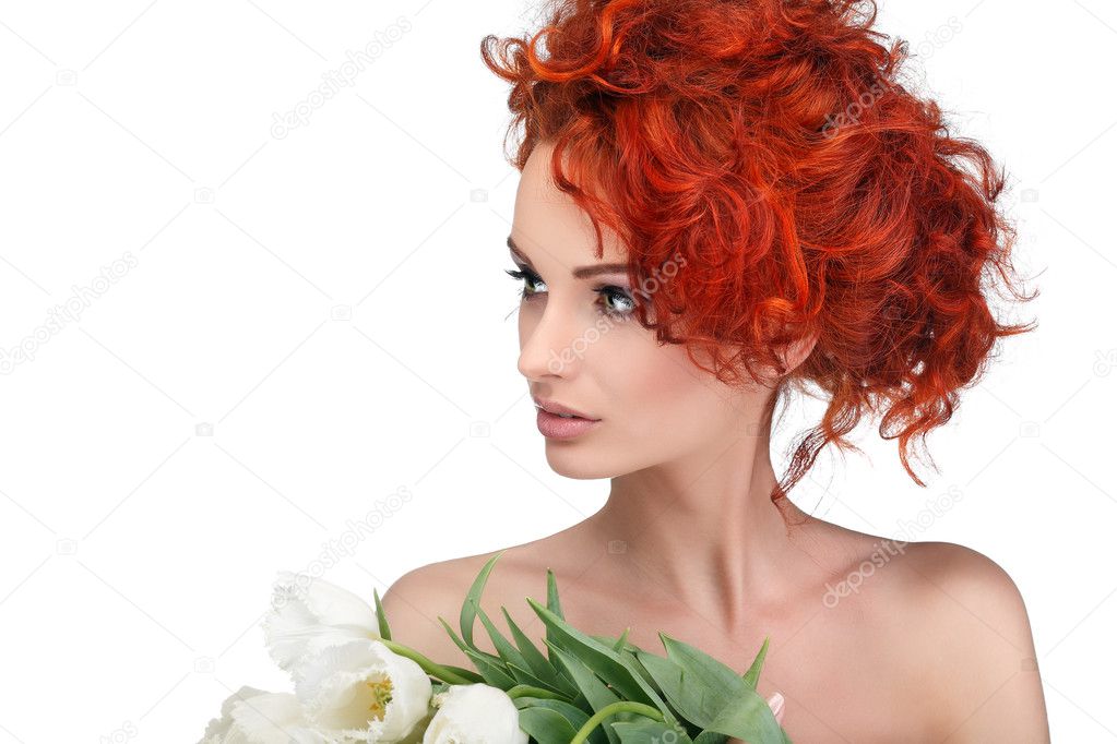 Beautiful young redheaded girl with white tulips, isolated on a white background