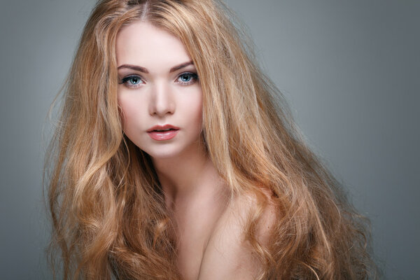 Beautiful  girl, isolated on a light - grey  background, emotions, cosmetics