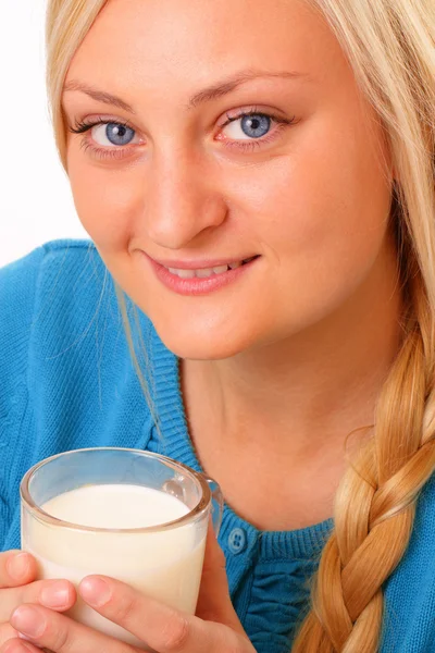 Happy blonde woman drinking milk — Stock Photo, Image