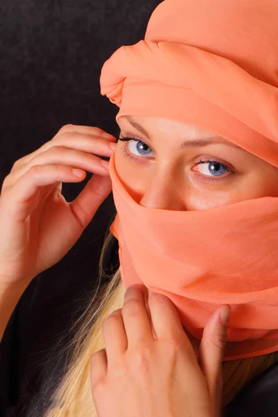 Mysterious blonde woman in cape — Stock Photo, Image