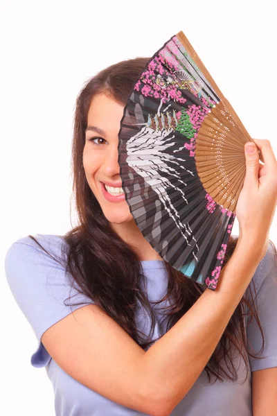 Jovem atraente com um ventilador — Fotografia de Stock