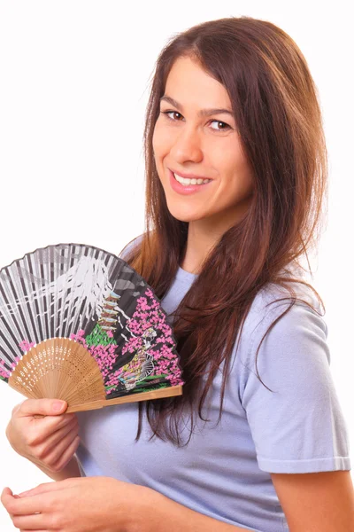 Happy young woman with a fan — Stock Photo, Image